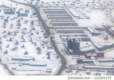 Nuuk city central streets and houses during the snowfall, aerial winter view from the plane, Greenland Nuuk city central streets and houses during the snowfall, aerial winter view from the plane, Greenland 122883176
