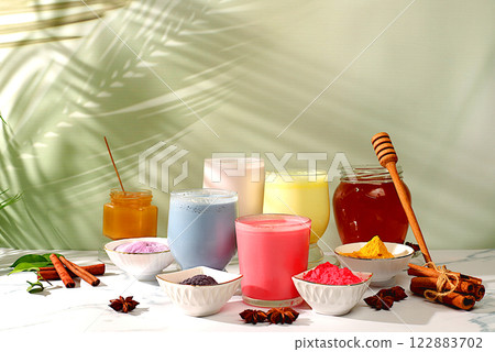 A variety of colorful matcha latte, Japanese tea, golden turmeric, lavender blue and pink moon milk. The trendy healthy drink promotes weight loss, a relaxing drink before bed and has 122883702