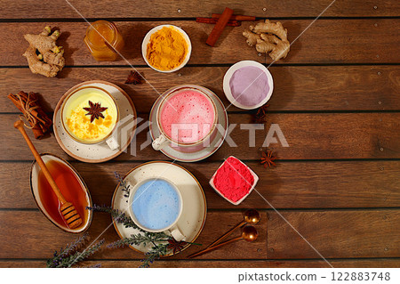 A variety of Japanese tea, matcha latte, golden turmeric, lavender blue and pink moon milk. The trendy healthy drink promotes weight loss, relaxes before bed and has anti-inflammatory properties.. 122883748
