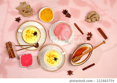 A variety of Japanese tea lattes made from golden turmeric and pink moon milk. The trendy healthy drink matcha promotes weight loss, relaxes before bed and has anti-inflammatory properties.. 122883754