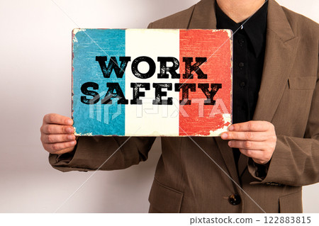 Work Safety. French flag in the hands of a business woman Work Safety. French flag in the hands of a business woman 122883815