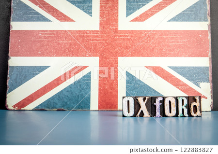 OXFORD. Urban Area in Great Britain. Flag and alphabet letters on wooden texture background 122883827