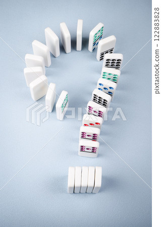 Dominoes arranged in the shape of a question mark Dominoes arranged in the shape of a question mark 122883828