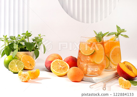 Ice cold homemade lemonade, juice or cocktail with mint, apricots, peaches and citrus fruits, recipe for a refreshing summer drink, detox diet and weight loss concept, menu for restaurant, Ice cold homemade lemonade, juice or cocktail with mint, apricots, peaches and citrus fruits, recipe for a refreshing summer drink, detox diet and weight loss concept, menu for restaurant, 122884133