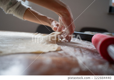 Stretching homemade pastry dough 122884440