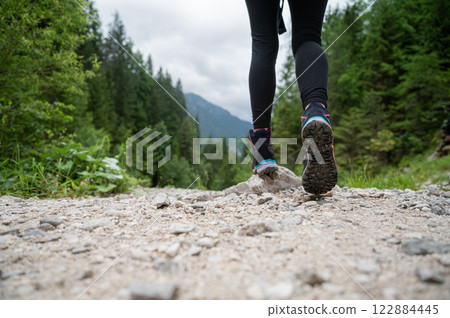 Low angle view of woman in hiking boots Low angle view of woman in hiking boots 122884445
