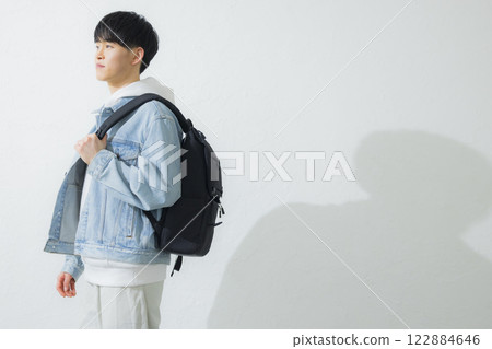 A man carrying a backpack 122884646