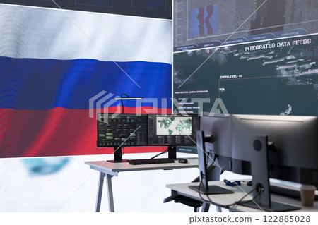 Empty russian army command center with a big screen showing the national flag, working on spreading fake news and propaganda to inflict fear and misinformation. Terrorist ideology. Empty russian army command center with a big screen showing the national flag, working on spreading fake news and propaganda to inflict fear and misinformation. Terrorist ideology. 122885028
