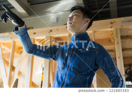 man working at construction site 122885383