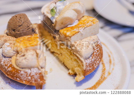 A luxurious pancake topped with cheesecake and ice cream - cross section A luxurious pancake topped with cheesecake and ice cream - cross section 122888088