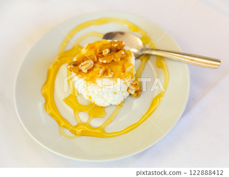 Cottage cheese with walnuts and honey Cottage cheese with walnuts and honey 122888412