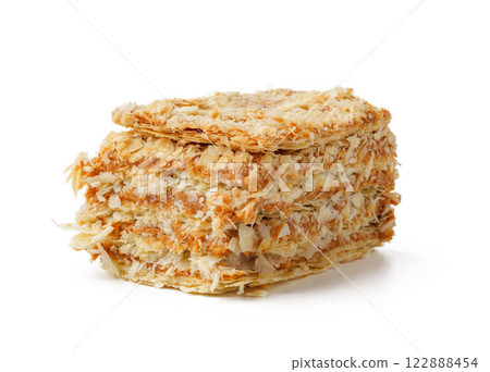 Delicious layers of crispy oat biscuits stacked elegantly on a white background showcasing texture and design 122888454