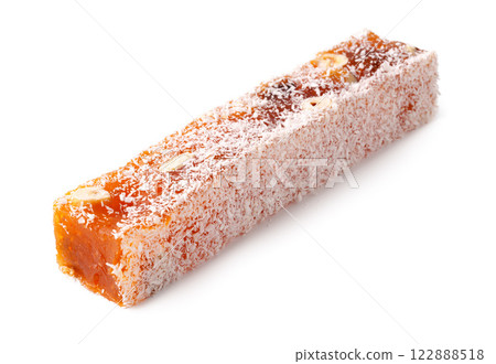 Traditional Turkish delight coated with coconut and filled with nuts on a plain background 122888518