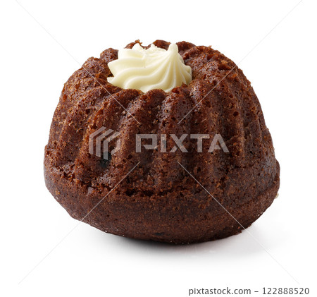 Delicious chocolate bundt cake topped with cream, perfect for dessert or celebration gatherings 122888520