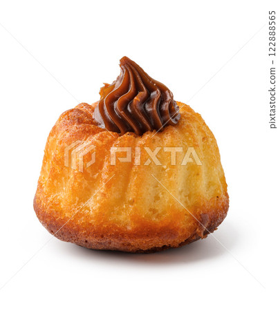 Delicious small cake topped with chocolate frosting perfect for tea time or dessert 122888565