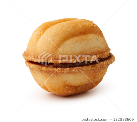 Sweet waffle coated in chopped nuts, perfect for a delicious treat or dessert option during any time of the day Sweet waffle coated in chopped nuts, perfect for a delicious treat or dessert option during any time of the day 122888609