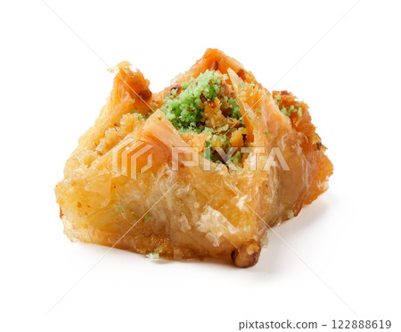 Delicious dessert with flaky pastry and nut filling enjoyed at a cultural event in a vibrant setting 122888619