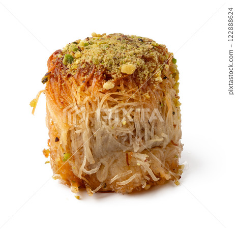 Traditional sweet dessert made from fine vermicelli pastry topped with nuts and sugar syrup Traditional sweet dessert made from fine vermicelli pastry topped with nuts and sugar syrup 122888624
