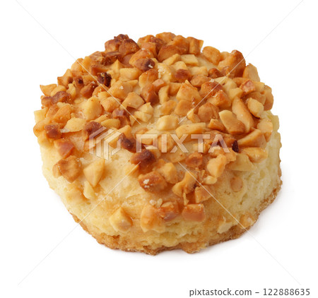Delicious cookie topped with crushed nuts sits on a plain background ready to be enjoyed Delicious cookie topped with crushed nuts sits on a plain background ready to be enjoyed 122888635