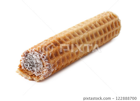 Delicious coconut-filled wafer roll rests on a clean surface, ready to be enjoyed as a sweet treat Delicious coconut-filled wafer roll rests on a clean surface, ready to be enjoyed as a sweet treat 122888700