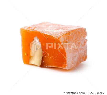 Traditional Turkish delight filled with nuts, showcasing vibrant color and texture in a close-up view 122888707