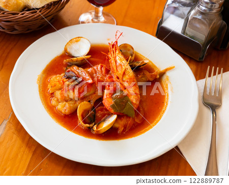 Tail of monkfish with shellfish, prawns 122889787