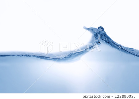 Closeup view of dynamic flowing blue water waves on white background. Liquid splash. Texture and abstract background Closeup view of dynamic flowing blue water waves on white background. Liquid splash. Texture and abstract background 122890053