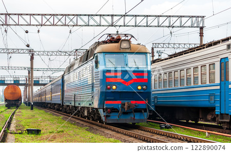 Electric locomotive hauling a passenger train in Siversk, currently an active war zone in Russo-Ukrainian War in Donetsk region of Ukraine 122890074