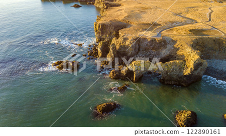 Aerial landscape of the cliff and ocean view with sunrise scene on Arnarstapi, Iceland. Taken by drone. Nature, travel, winter background, or wallpaper Aerial landscape of the cliff and ocean view with sunrise scene on Arnarstapi, Iceland. Taken by drone. Nature, travel, winter background, or wallpaper 122890161