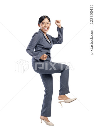Portrait of an Asian businesswoman raising hands with an excited expression isolated over a white background. Concept of business, entrepreneur, and successful Portrait of an Asian businesswoman raising hands with an excited expression isolated over a white background. Concept of business, entrepreneur, and successful 122890433