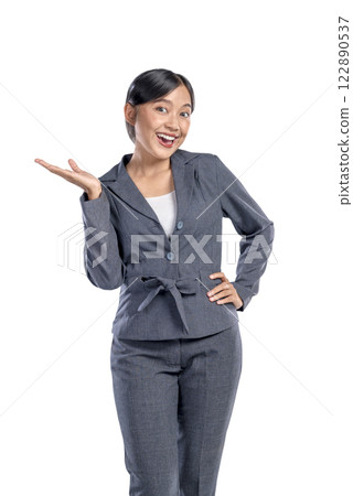 Portrait of an Asian businesswoman standing with open palm hand gesture isolated over a white background. Copy space. Concept of business, entrepreneur, and successful Portrait of an Asian businesswoman standing with open palm hand gesture isolated over a white background. Copy space. Concept of business, entrepreneur, and successful 122890537