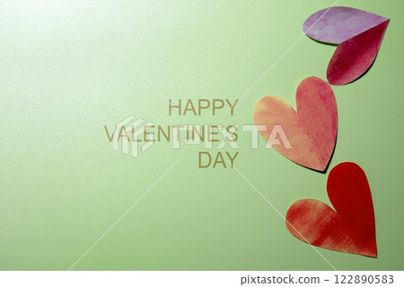Red hearts with text of Happy Valentine Day on a colored background 122890583