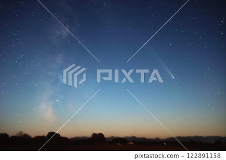 Mount Shikin shining in the sunset sky in the Tokachi region of Hokkaido on October 20, 2024 - Comet Atlas 122891158