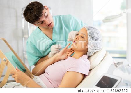 doctor calmly presents procedure's results doctor calmly presents procedure's results 122892732