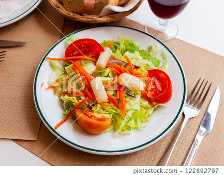 Fresh healthy salad with assorted greens and vegetables Fresh healthy salad with assorted greens and vegetables 122892797