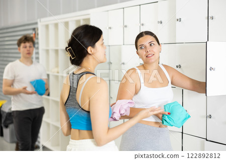 Women exchanged couple of phrases in ladies locker room after changing clothes Women exchanged couple of phrases in ladies locker room after changing clothes 122892812