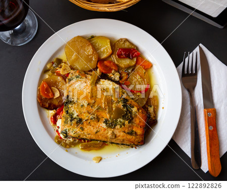 Baked salmon fillet with mix of vegetables Baked salmon fillet with mix of vegetables 122892826