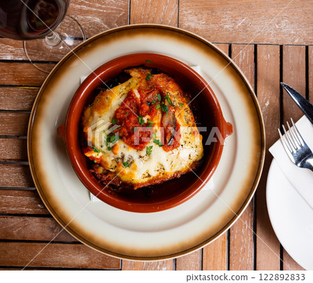 Eggplant and tomatoes served with parmesan Eggplant and tomatoes served with parmesan 122892833