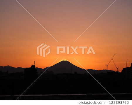 The silhouette of Mt. Fuji floating in the sunset sky The silhouette of Mt. Fuji floating in the sunset sky 122893753
