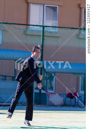 Middle men playing tennis Middle men playing tennis 122895417