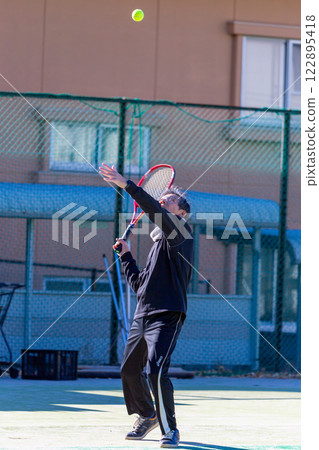 Middle men playing tennis Middle men playing tennis 122895418