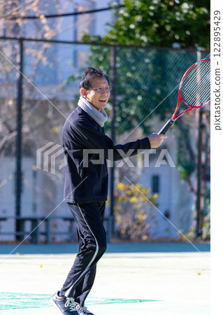 Middle men playing tennis Middle men playing tennis 122895429