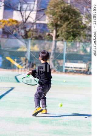 Boy playing tennis, toddler 122895656