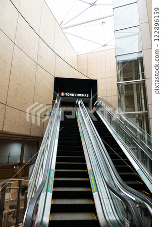 Going up the escalator leading to TOHO Cinemas Fuchu, Miyacho, Fuchu City, Tokyo Going up the escalator leading to TOHO Cinemas Fuchu, Miyacho, Fuchu City, Tokyo 122896159