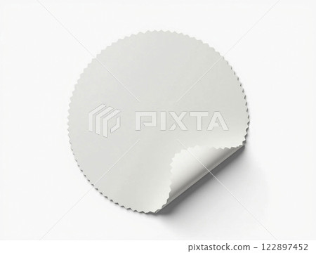 Circular white backing paper with a curled edge on a light background ideal for crafting and design projects 122897452