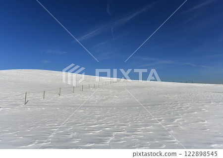 Snowy scenery and deep blue sky on a ranch in the dead of winter 122898545