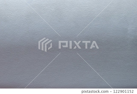 grey blue fabric velvet texture with lighter upper part and darker lower part, gradient from grey to blue with play of light on soft textile material 122901152
