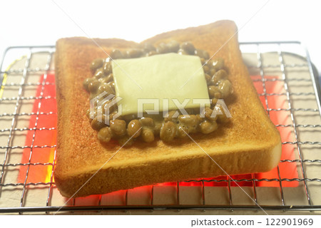 Toasting bread on a charcoal grill Toasting bread on a charcoal grill 122901969