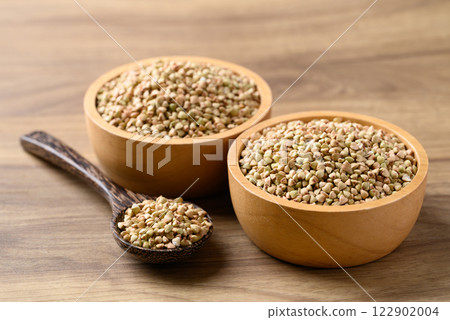 Organic buckwheat seed in wooden bowl with spoon, Food ingredient Organic buckwheat seed in wooden bowl with spoon, Food ingredient 122902004