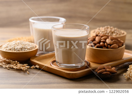 Alternative milk made from plant on wooden background, non dairy, Vegan food Alternative milk made from plant on wooden background, non dairy, Vegan food 122902056